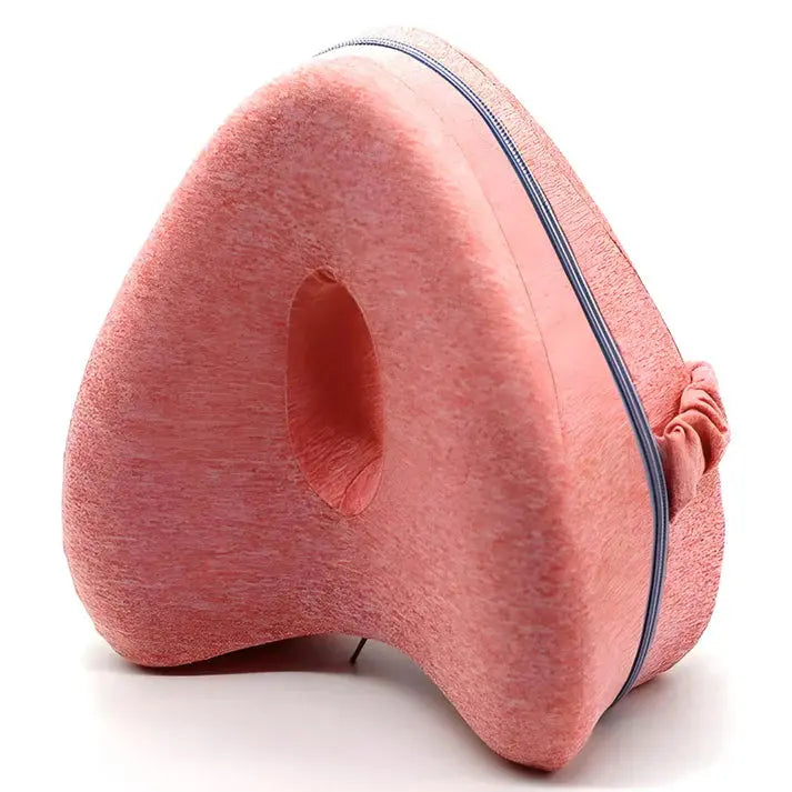 Ergonomic alignment pillow in soft pink, designed to relieve joint pain and enhance sleep comfort.